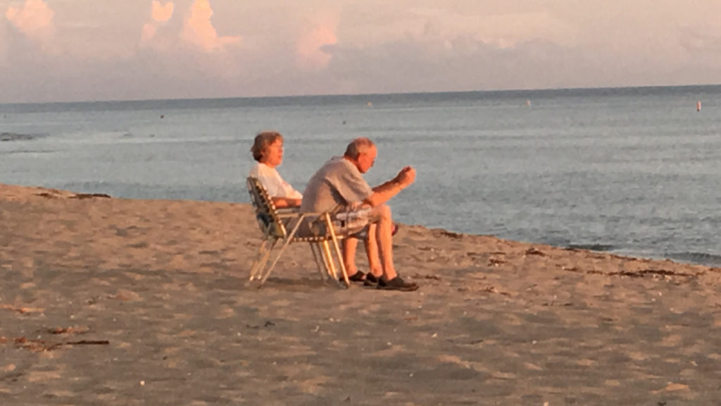 Photo of an older couple on the beach. Credit and Copyright 2018 Jill Edelman.